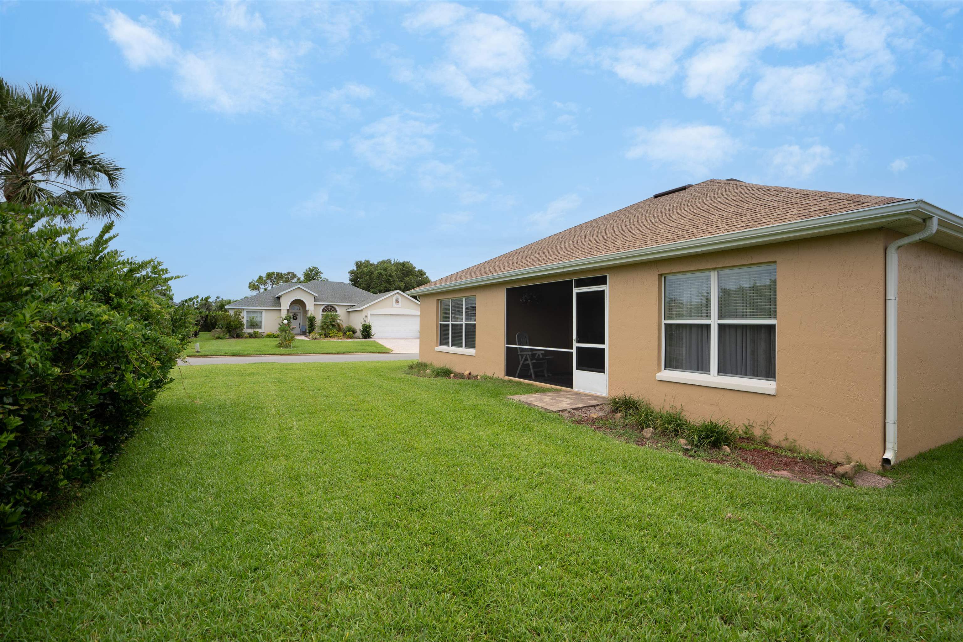 2325 Commodores Club Boulevard St. Augustine, FL 32080 - Photo 35 of 38 a front view of house with yard and green space