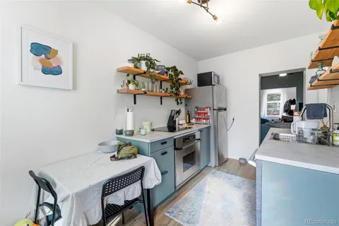 a kitchen with a sink cabinets and stove top oven
