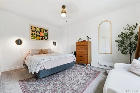 a bedroom with a bed and a dresser