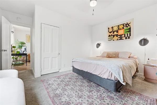 a bedroom with a bed and a couch