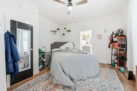 a bed room with a bed and a flat screen tv