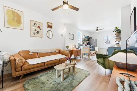 a living room with furniture and a table