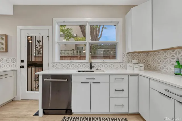 a kitchen with a stove and a sink