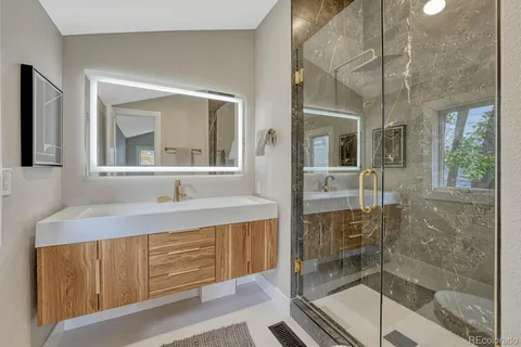 a bathroom with a shower and a toilet