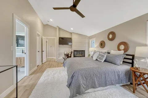 a spacious bedroom with a bed closet and a window