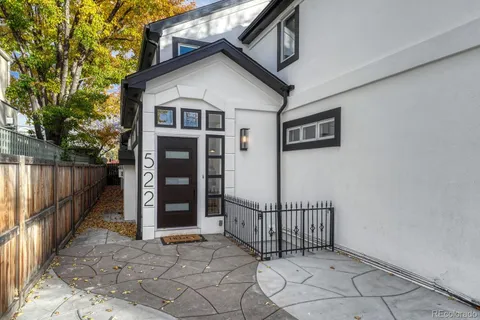 a living room with fireplace furniture and a flat screen tv
