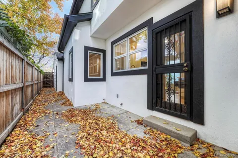 a view of a backyard with sitting area