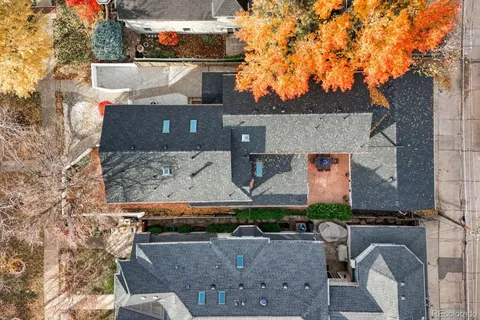 a picture of a room with a white wall and a large window