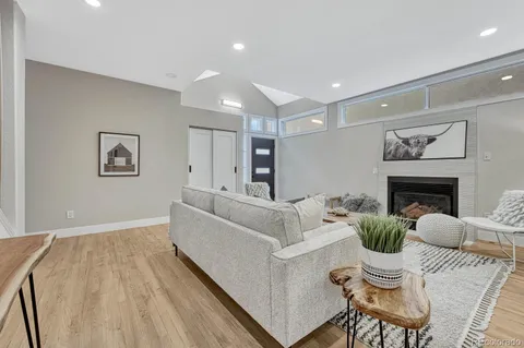 a living room with furniture and a rug