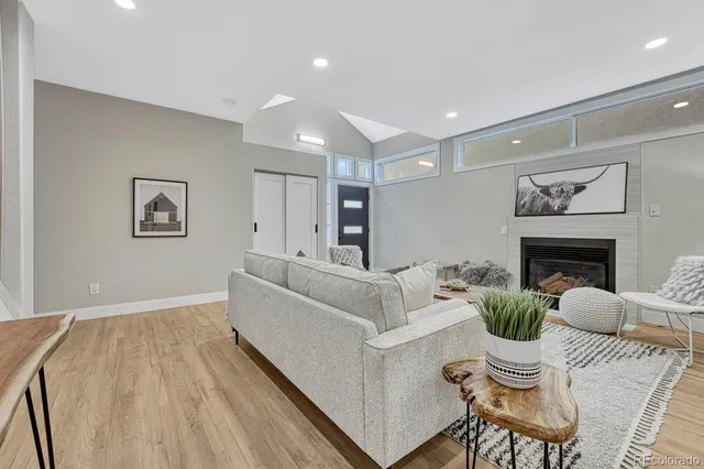 a living room with furniture and a rug