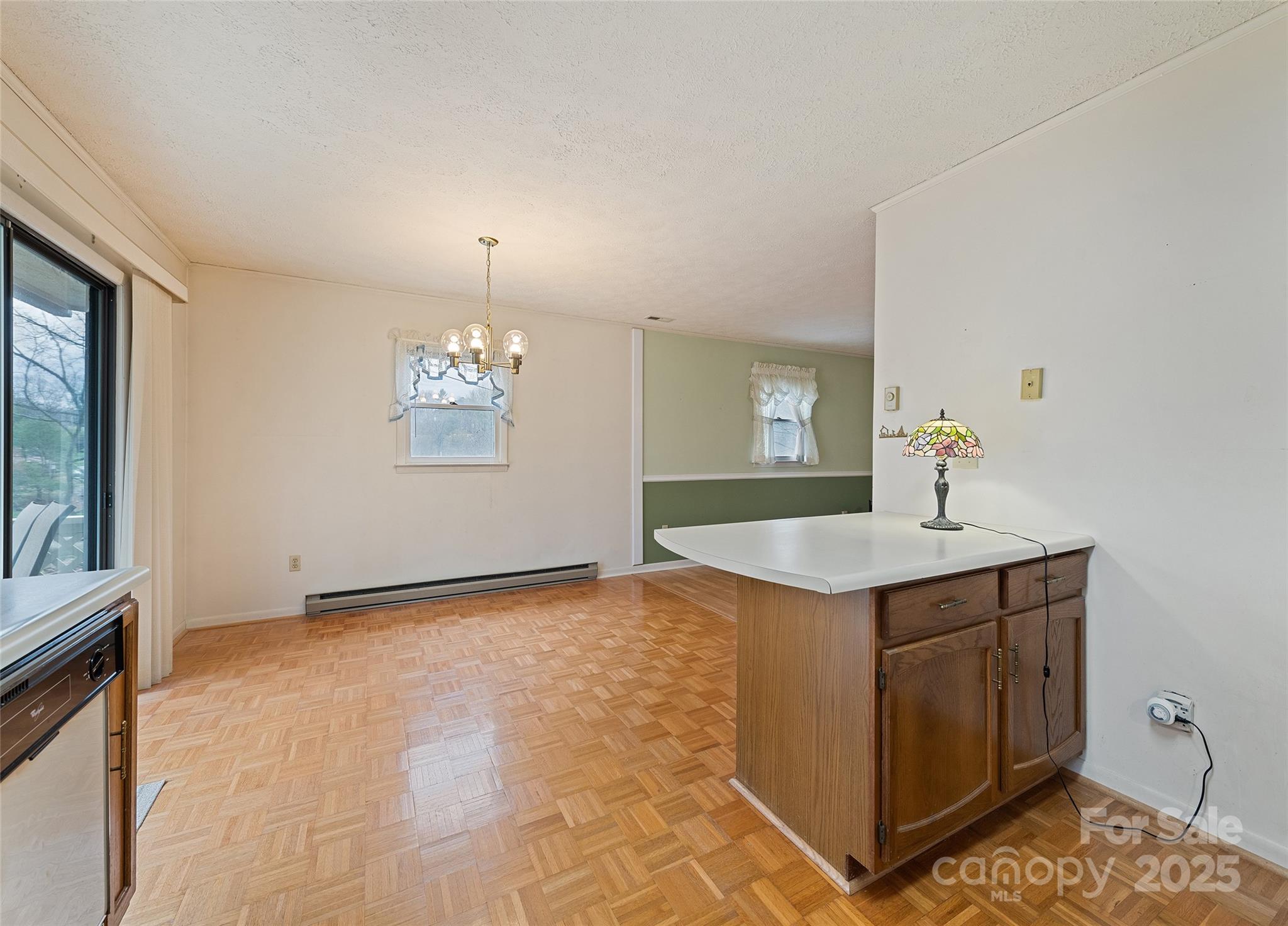 192 Poplar Drive Clyde, NC 28721 - Photo 12 of 33 a view of a kitchen with marble countertop cabinets and sink