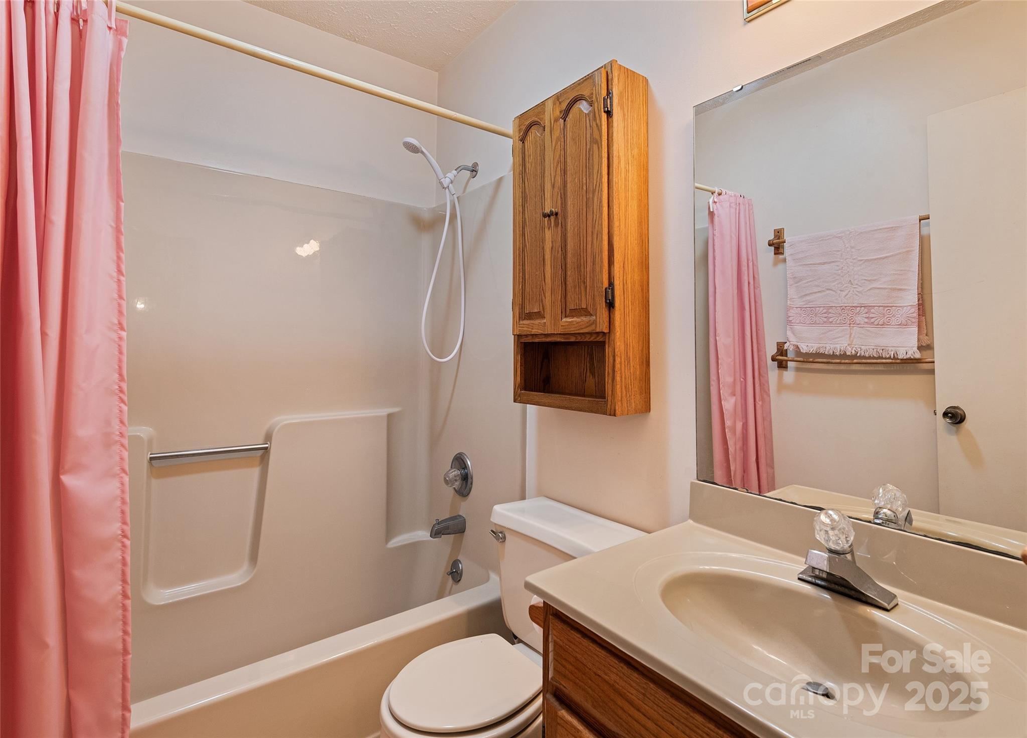 192 Poplar Drive Clyde, NC 28721 - Photo 18 of 33 a bathroom with a granite countertop sink toilet and shower