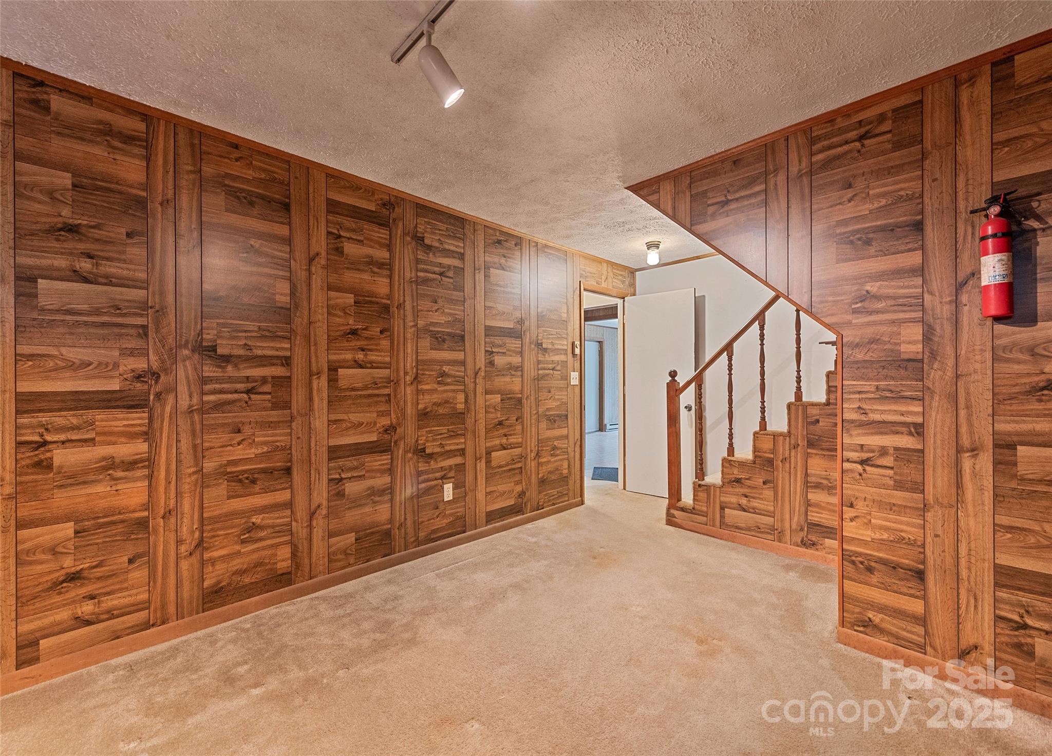 192 Poplar Drive Clyde, NC 28721 - Photo 21 of 33 a view of an empty room with wooden walls
