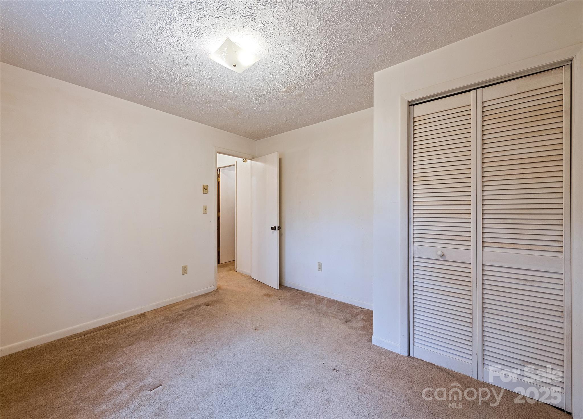 192 Poplar Drive Clyde, NC 28721 - Photo 23 of 33 a view of an empty room with a window
