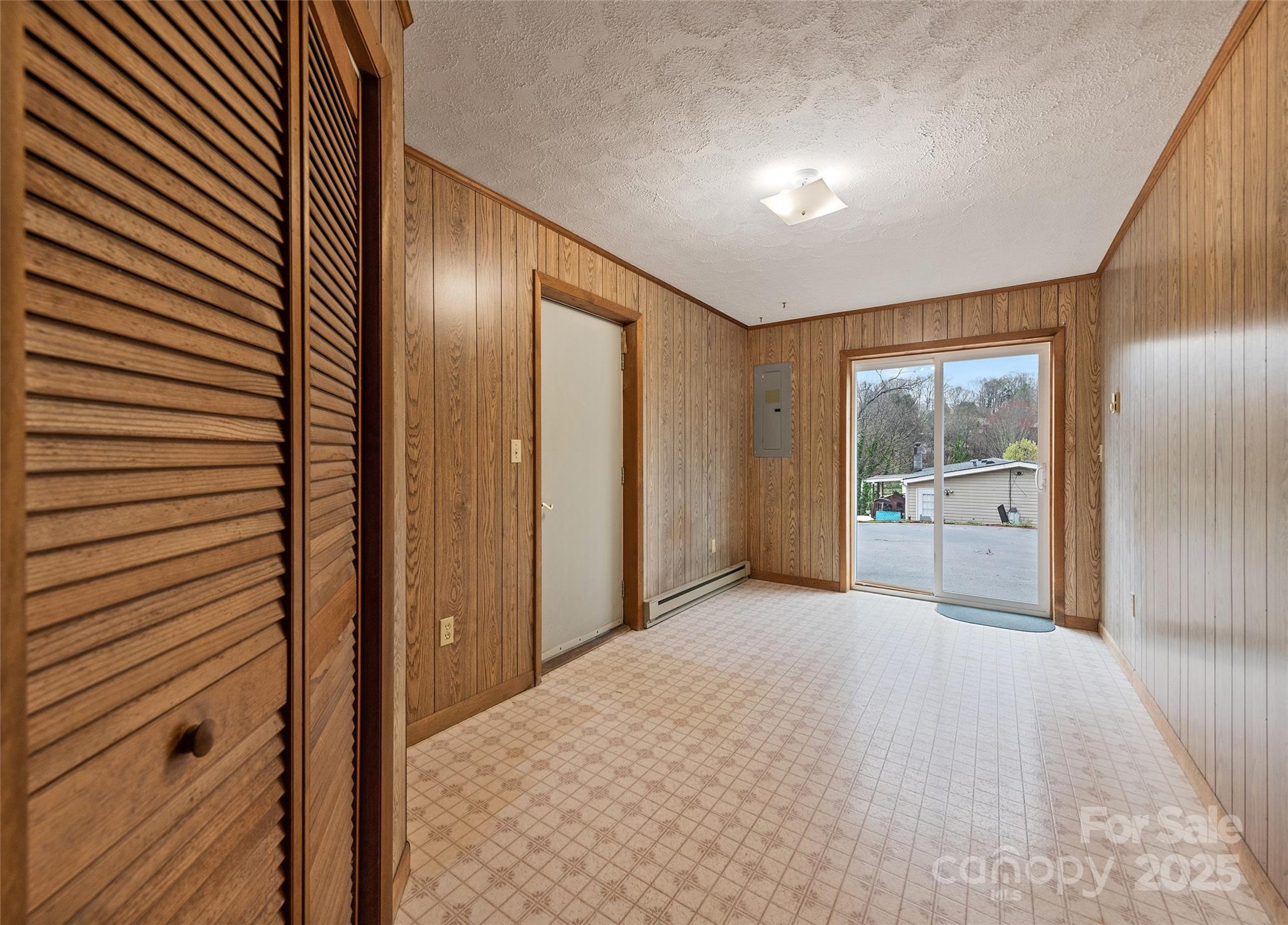 192 Poplar Drive Clyde, NC 28721 - Photo 25 of 33 a view of an empty room with kitchen and a window
