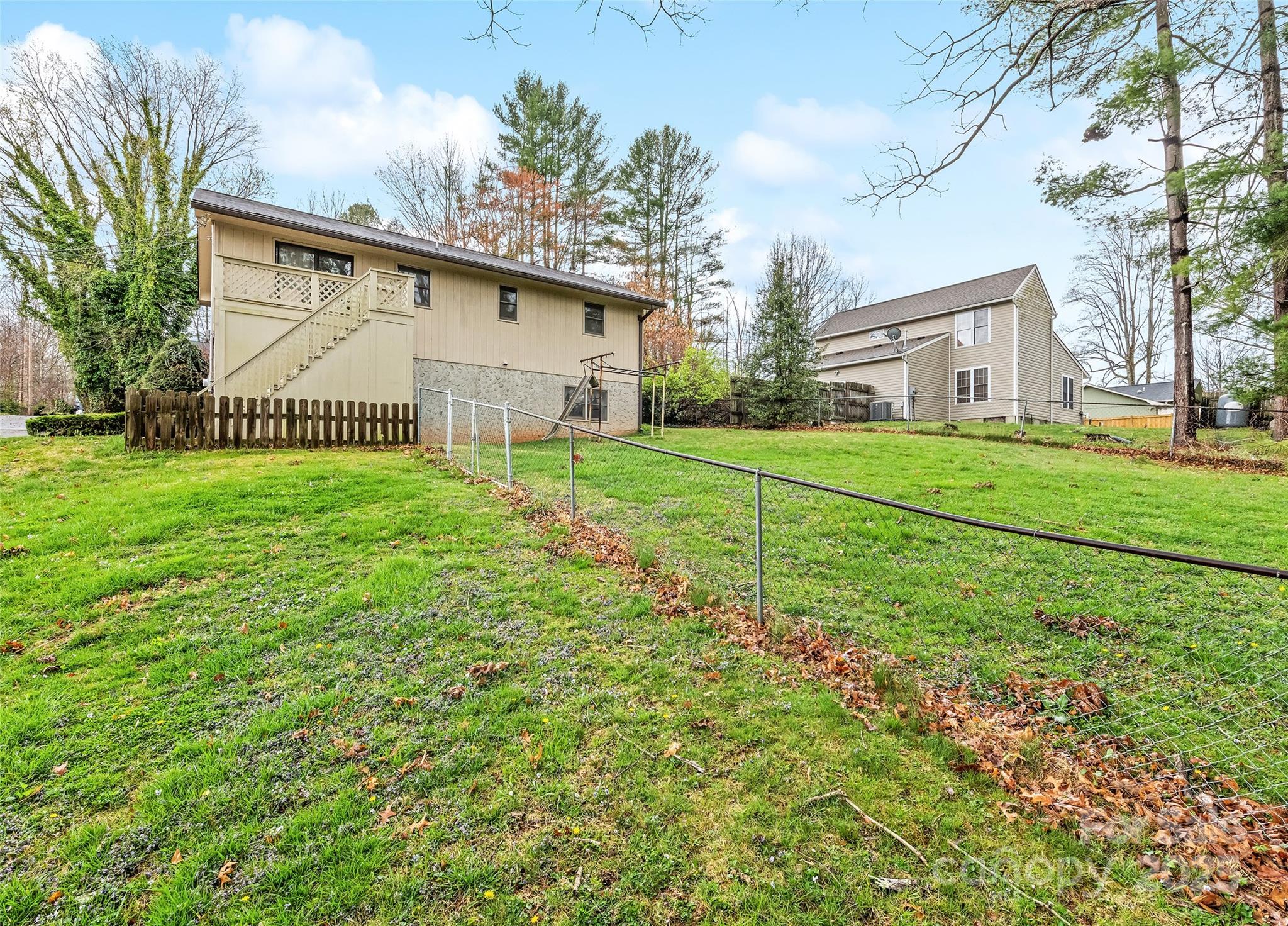 192 Poplar Drive Clyde, NC 28721 - Photo 28 of 33 a view of a house with a yard and fence