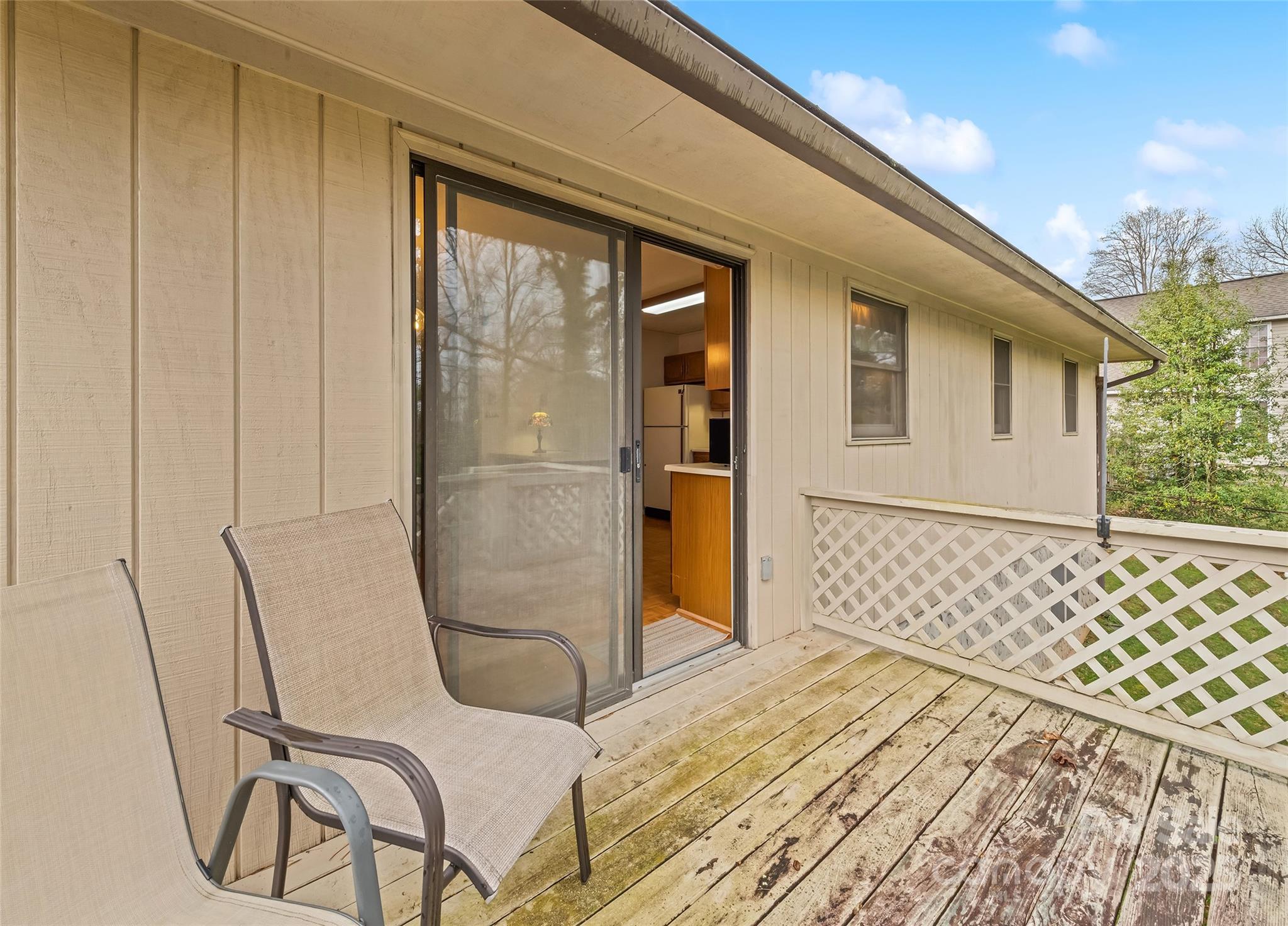 192 Poplar Drive Clyde, NC 28721 - Photo 32 of 33 a bed room with a bed and a chair