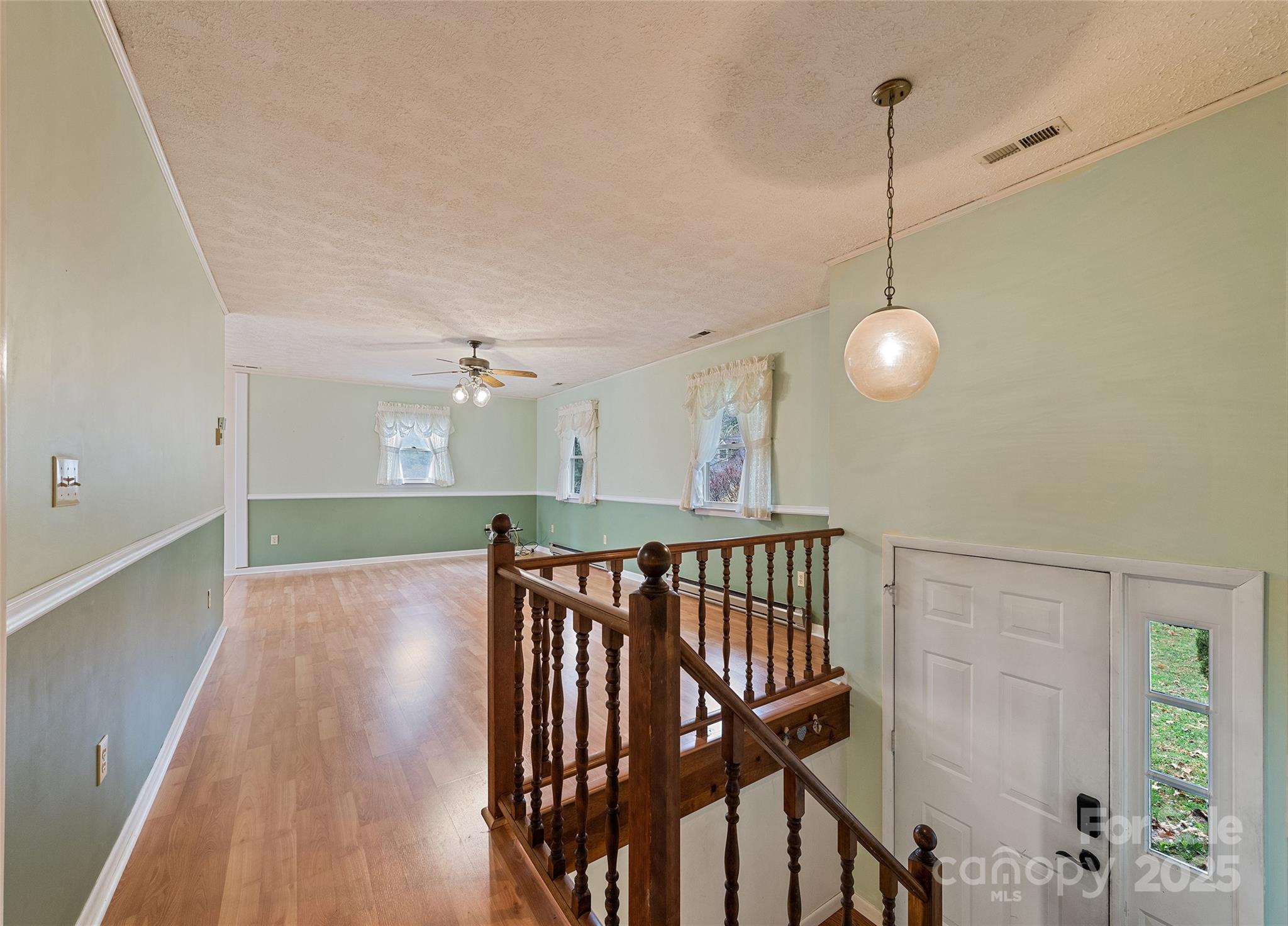 192 Poplar Drive Clyde, NC 28721 - Photo 4 of 33 a view of an entryway with wooden floor