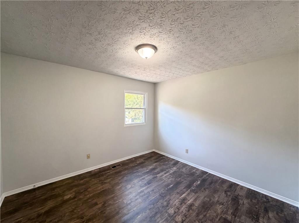6830 Earlhurst Road Atlanta, GA 30349 - Photo 16 of 27 an empty room with a window