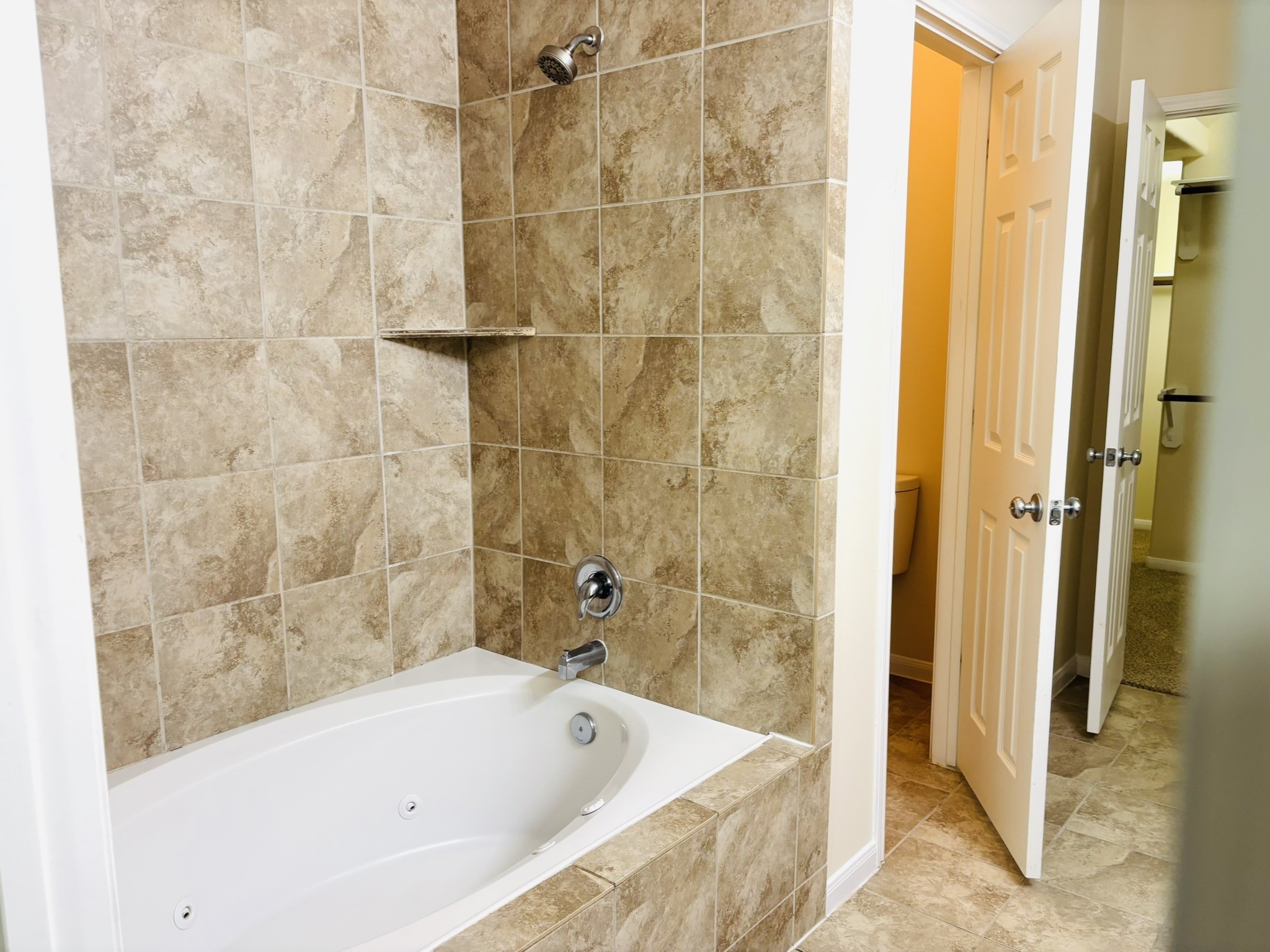 8525 Sunset Loch Drive Spring, TX 77379 - Photo 13 of 28 a bathroom with a bathtub and shower