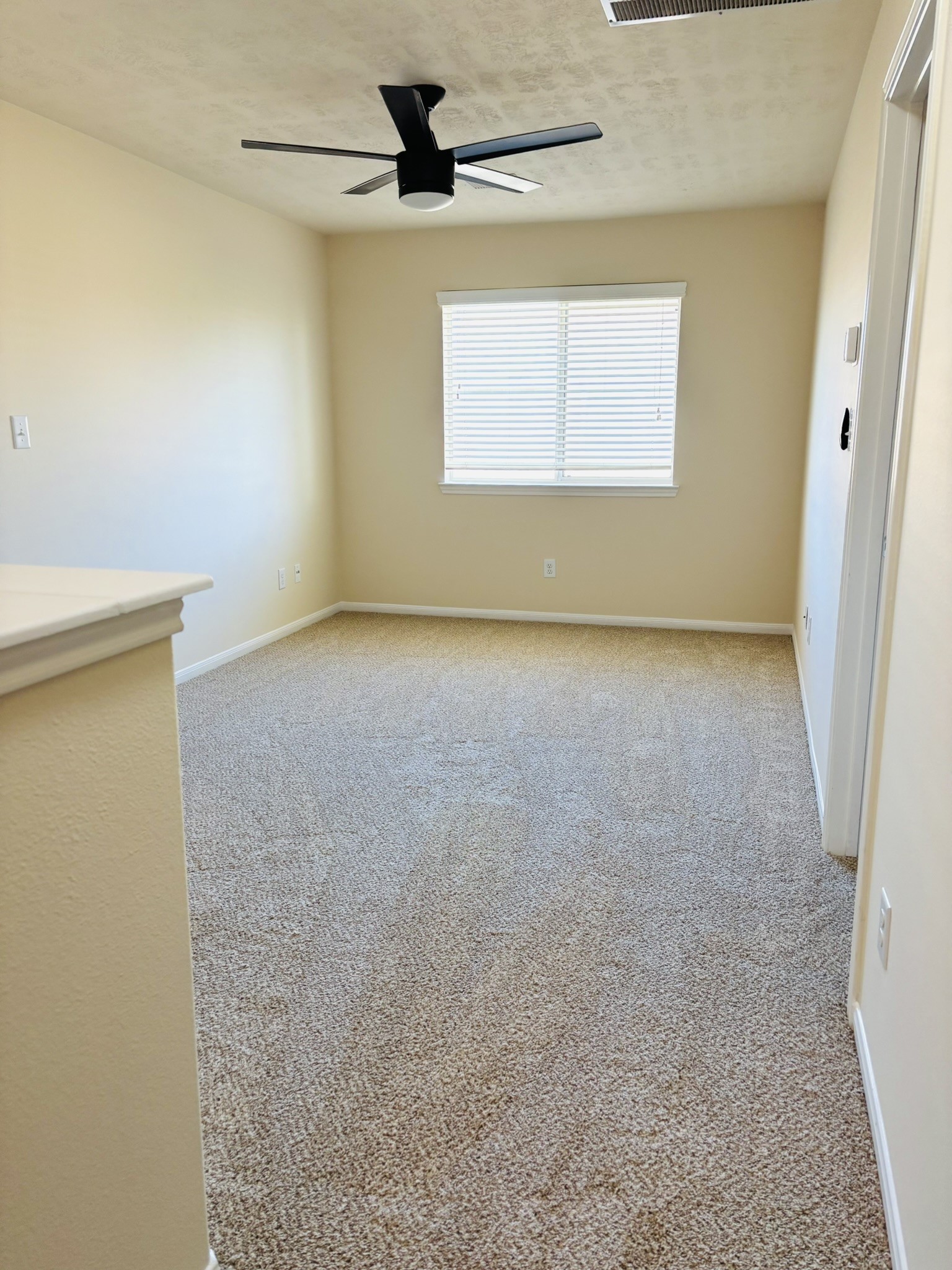 8525 Sunset Loch Drive Spring, TX 77379 - Photo 21 of 28 an empty room with a empty space and a ceiling fan