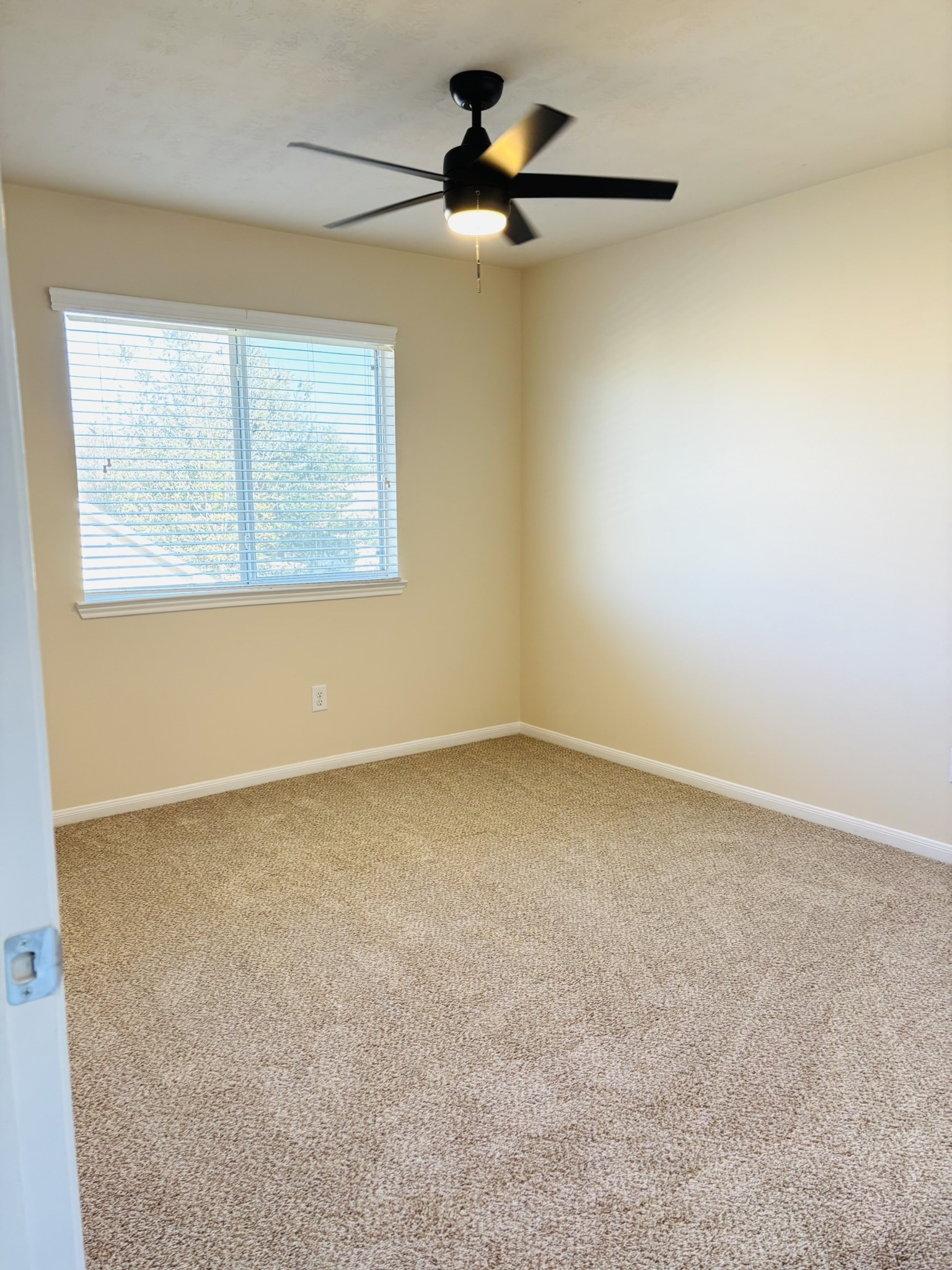 8525 Sunset Loch Drive Spring, TX 77379 - Photo 23 of 28 an empty room with a window and a fan