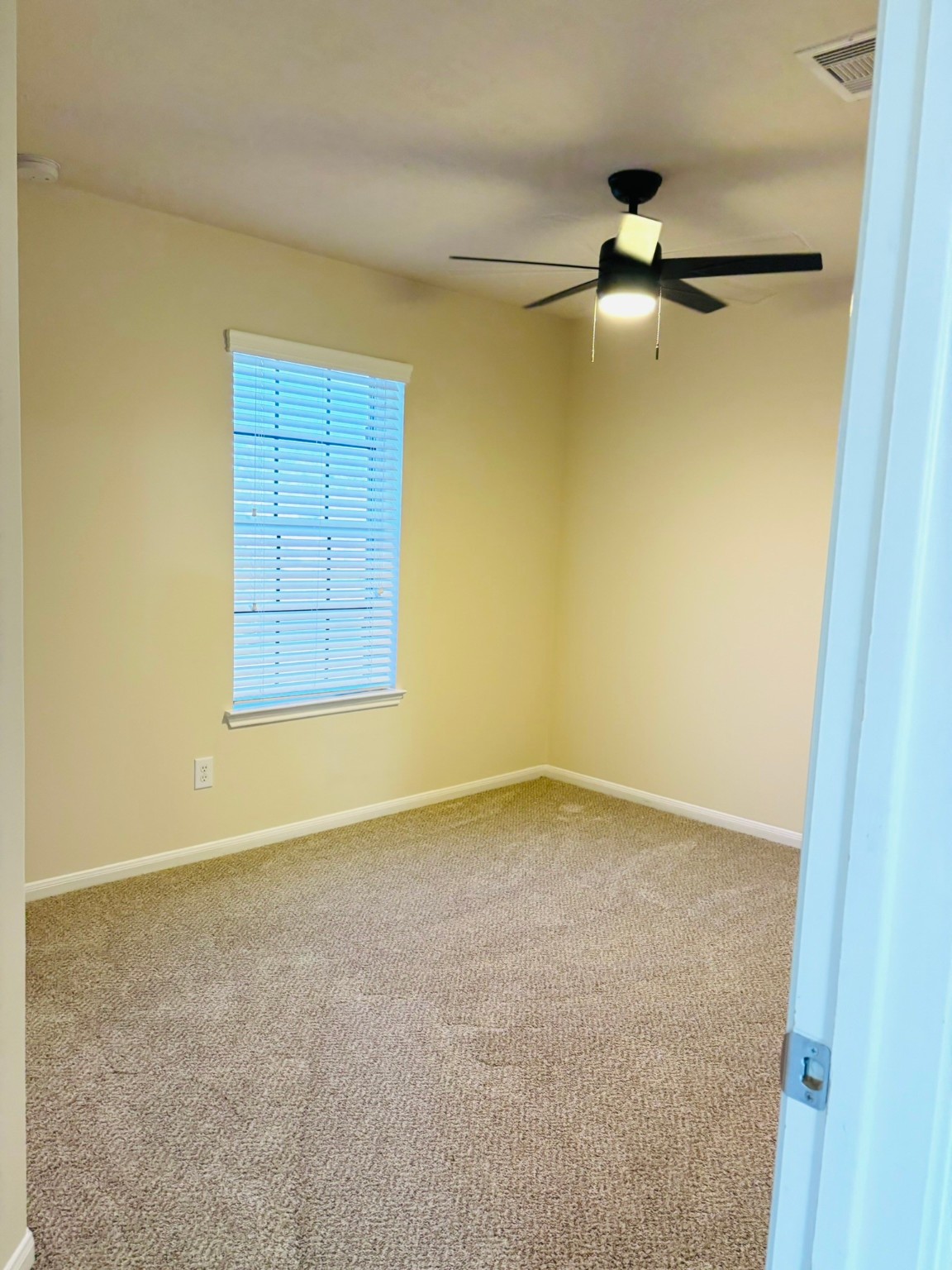 8525 Sunset Loch Drive Spring, TX 77379 - Photo 24 of 24 an empty room with a ceiling fan and carpet