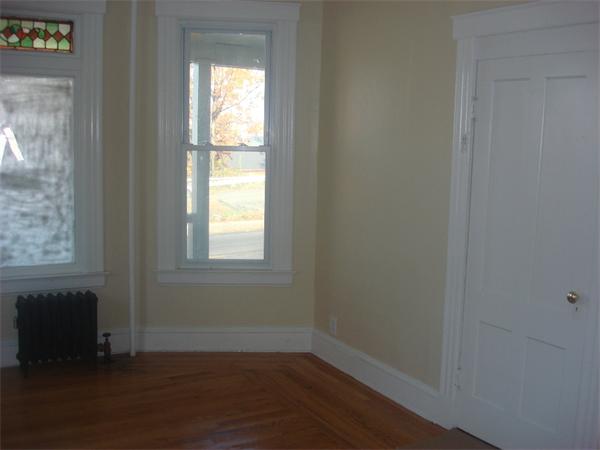 30 Allen Street Springfield, MA 01108 - Photo 3 of 9 a view of an empty room with wooden floor and a window