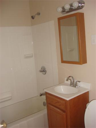 30 Allen Street Springfield, MA 01108 - Photo 5 of 9 a bathroom with a sink a toilet and shower