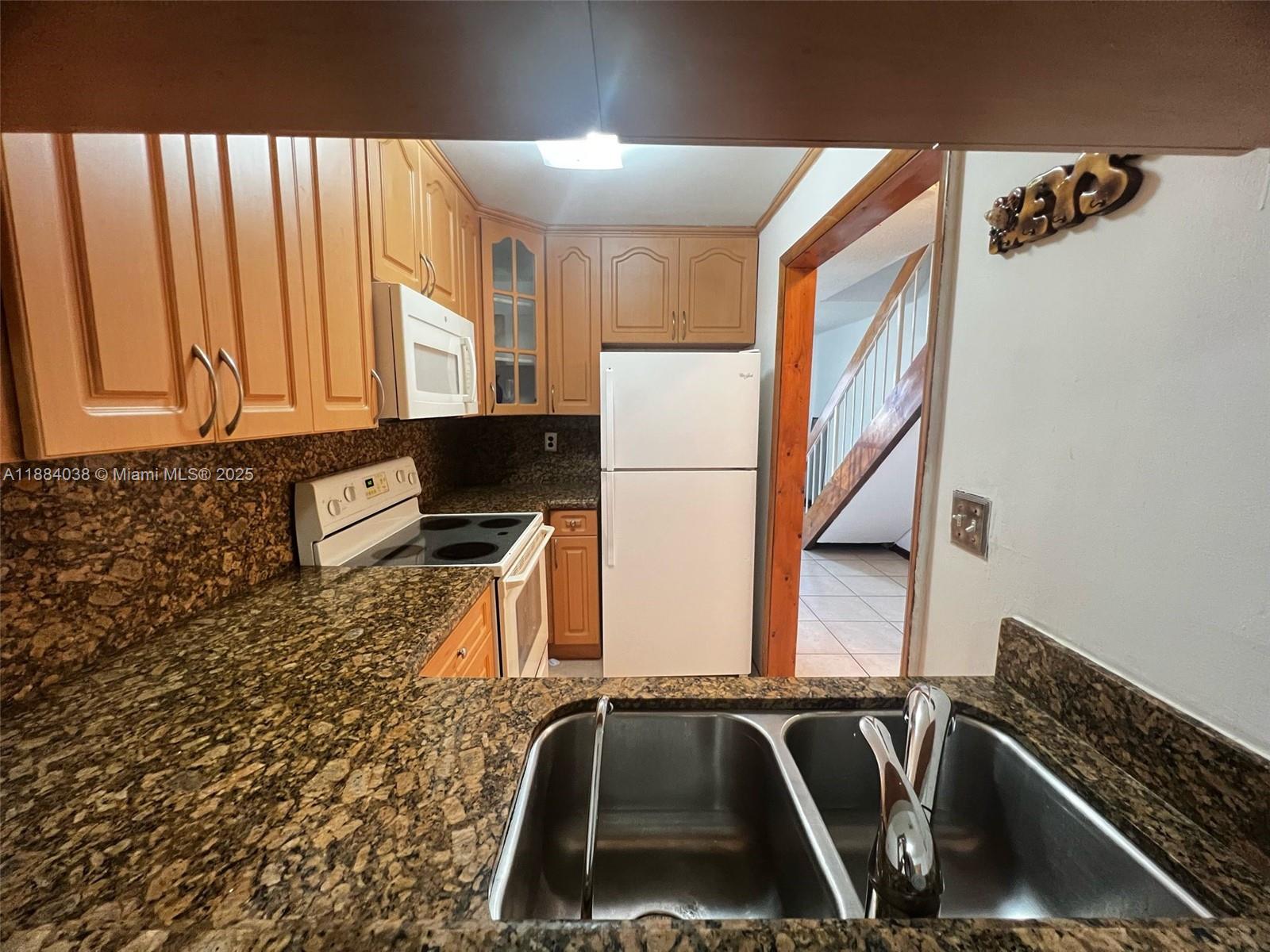 13345 Southwest 59th Lane Miami, FL 33183 - Photo 12 of 29 a bathroom with a sink and a mirror