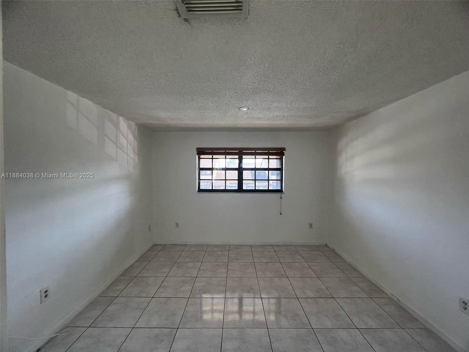 13345 Southwest 59th Lane Miami, FL 33183 - Photo 17 of 29 an empty room with windows