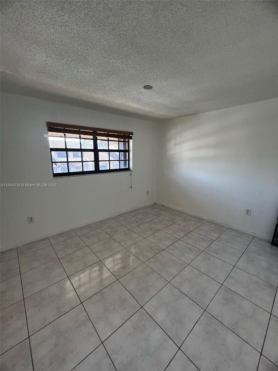 13345 Southwest 59th Lane Miami, FL 33183 - Photo 20 of 29 an empty room with windows