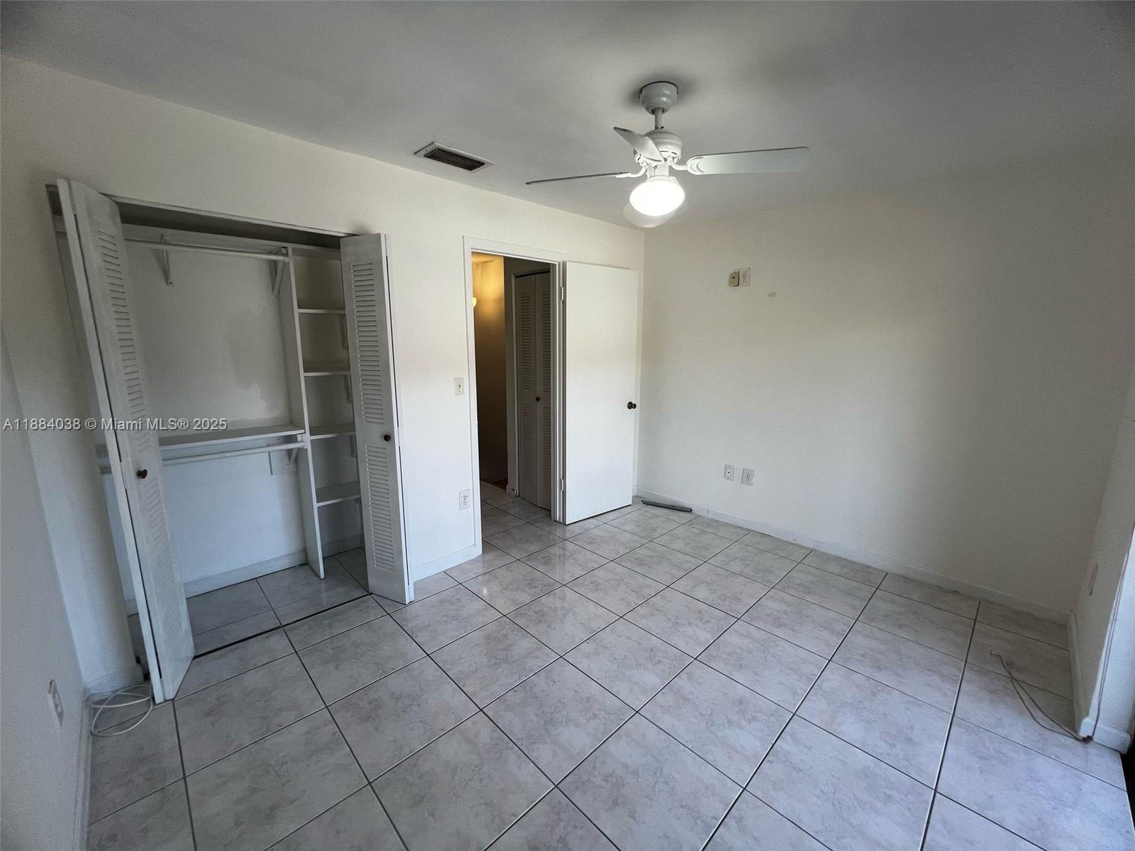 13345 Southwest 59th Lane Miami, FL 33183 - Photo 25 of 29 wooden floor in an empty room with a mirror