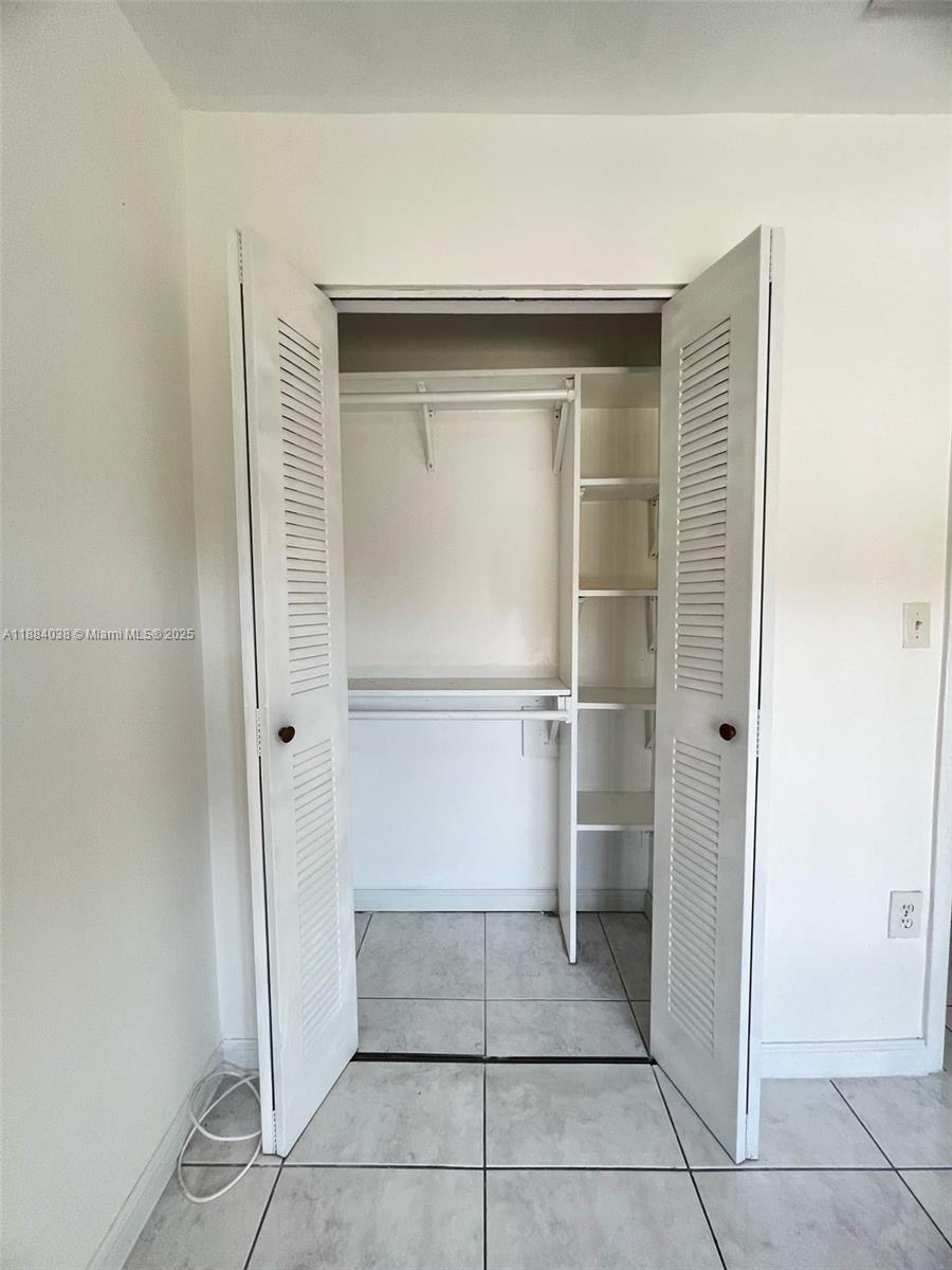 13345 Southwest 59th Lane Miami, FL 33183 - Photo 26 of 29 a view of a closet area in a room