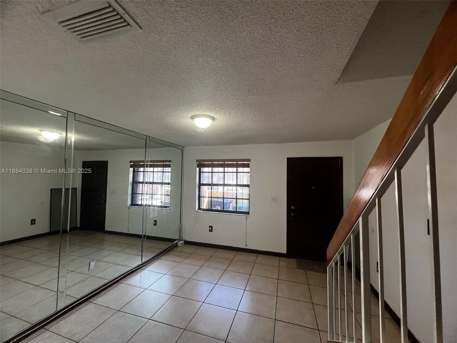 13345 Southwest 59th Lane Miami, FL 33183 - Photo 5 of 29 an empty room with windows
