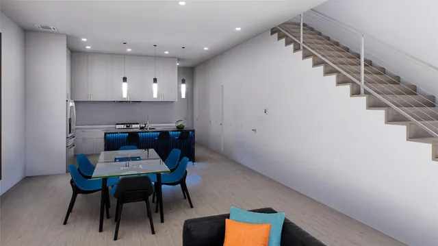 a large kitchen with stainless steel appliances granite countertop a stove and a sink