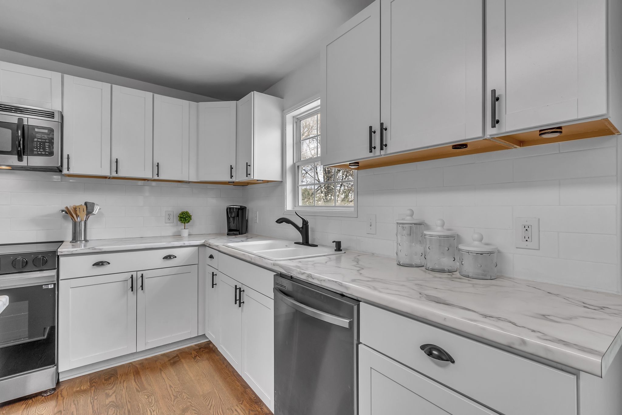 2006 Trenton Drive Spring Hill, TN 37174 - Photo 11 of 36 a kitchen with sink cabinets and white appliances