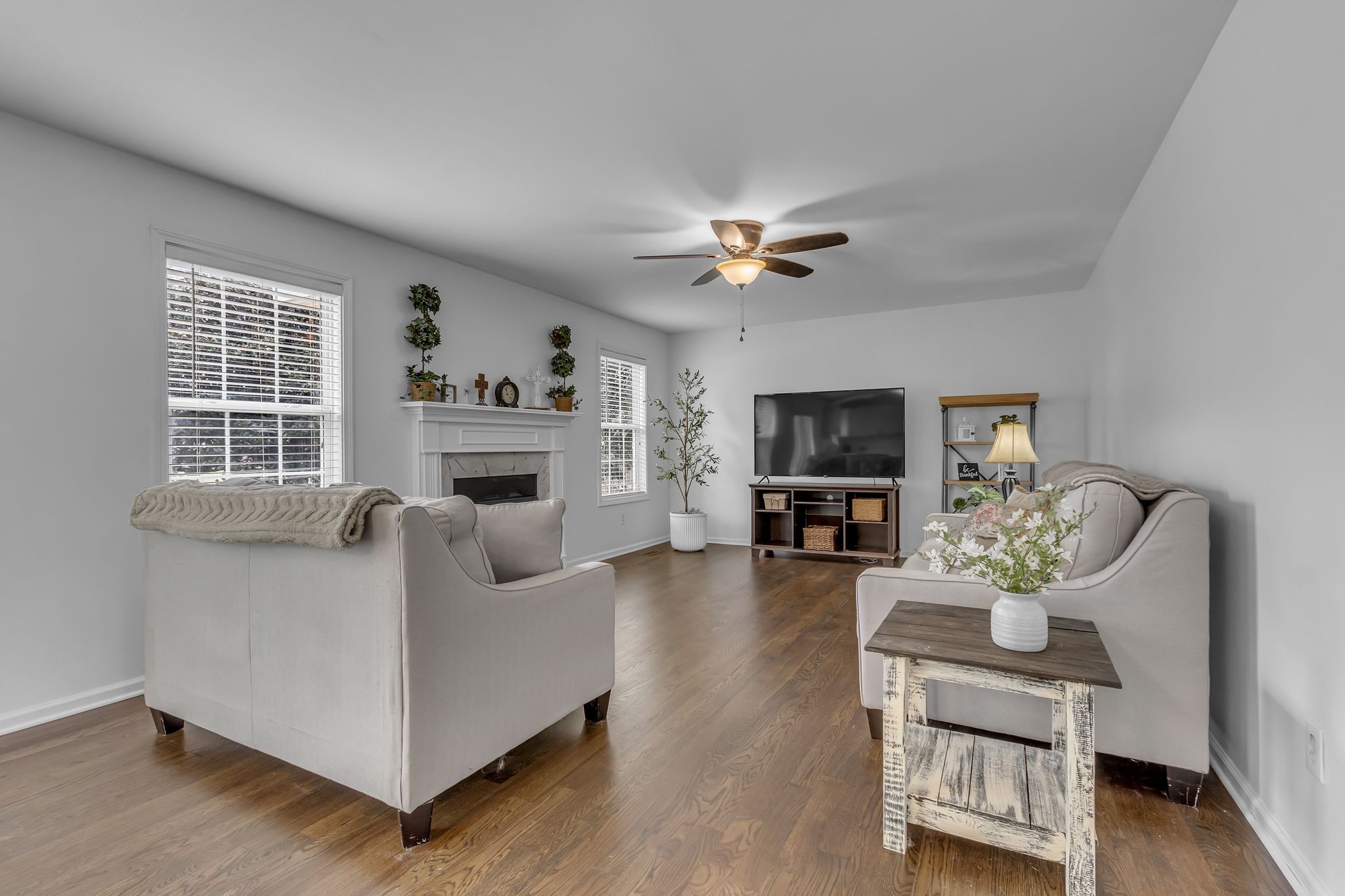 2006 Trenton Drive Spring Hill, TN 37174 - Photo 14 of 36 a living room with furniture a flat screen tv and a fireplace