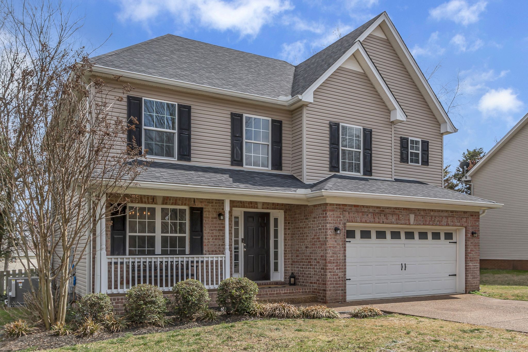 2006 Trenton Drive Spring Hill, TN 37174 - Photo 2 of 36 a front view of a house with a garden