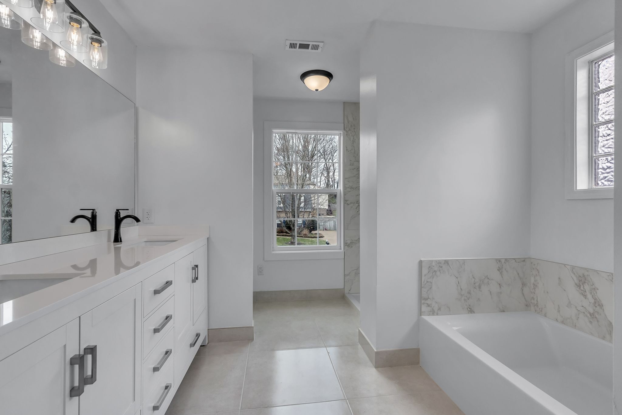 2006 Trenton Drive Spring Hill, TN 37174 - Photo 26 of 36 a bathroom with a tub sink and mirror