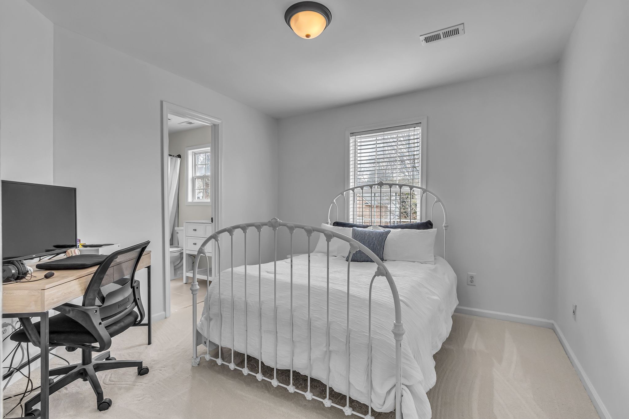 2006 Trenton Drive Spring Hill, TN 37174 - Photo 28 of 36 a bed sitting in a bedroom next to a window