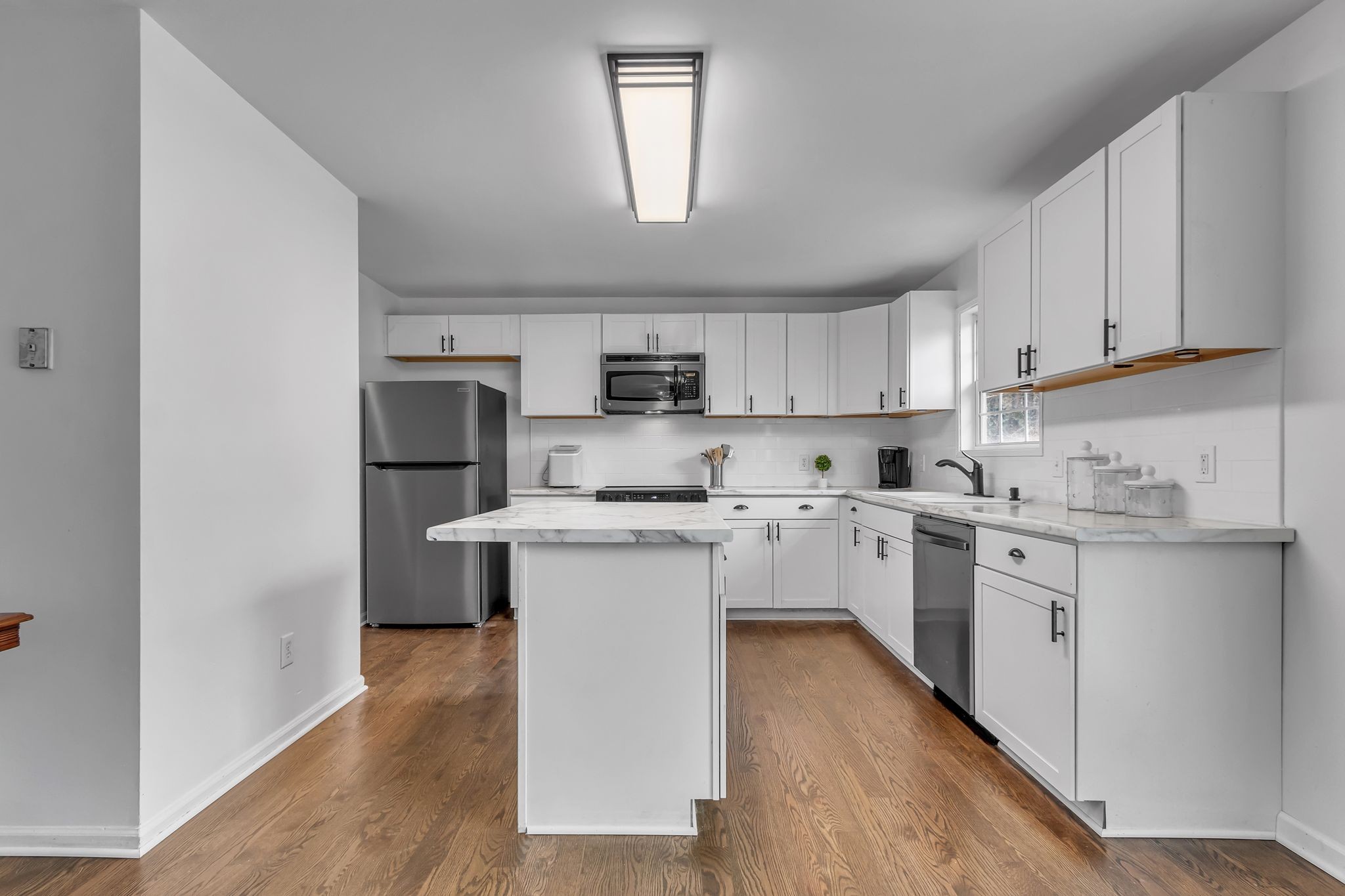 2006 Trenton Drive Spring Hill, TN 37174 - Photo 5 of 36 a kitchen with cabinets a sink and wooden floor