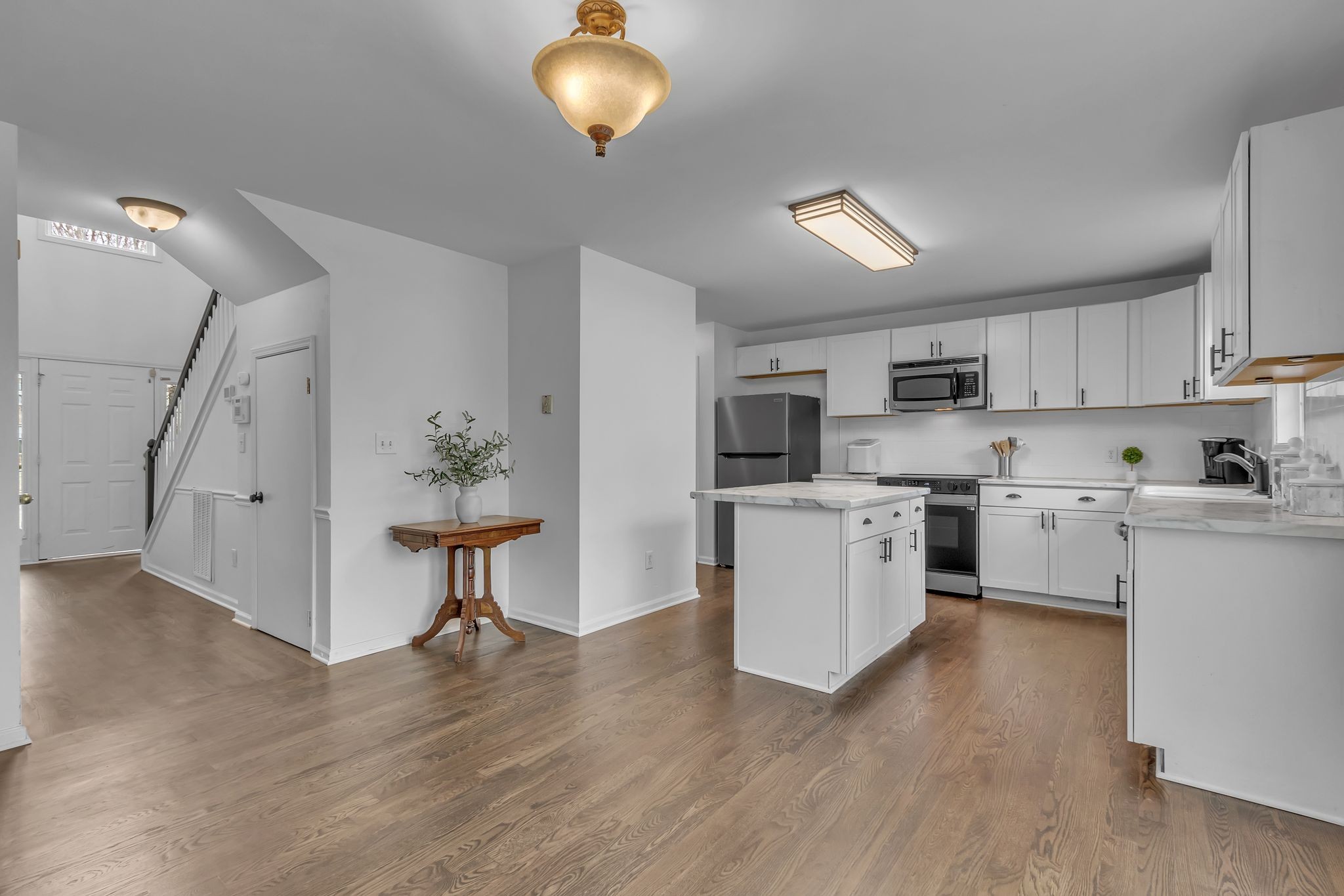 2006 Trenton Drive Spring Hill, TN 37174 - Photo 7 of 36 a kitchen with white cabinets and white appliances