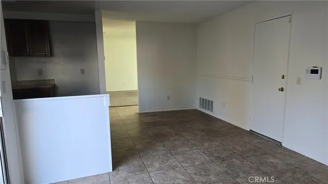 a view of a kitchen cabinets and a wooden floor