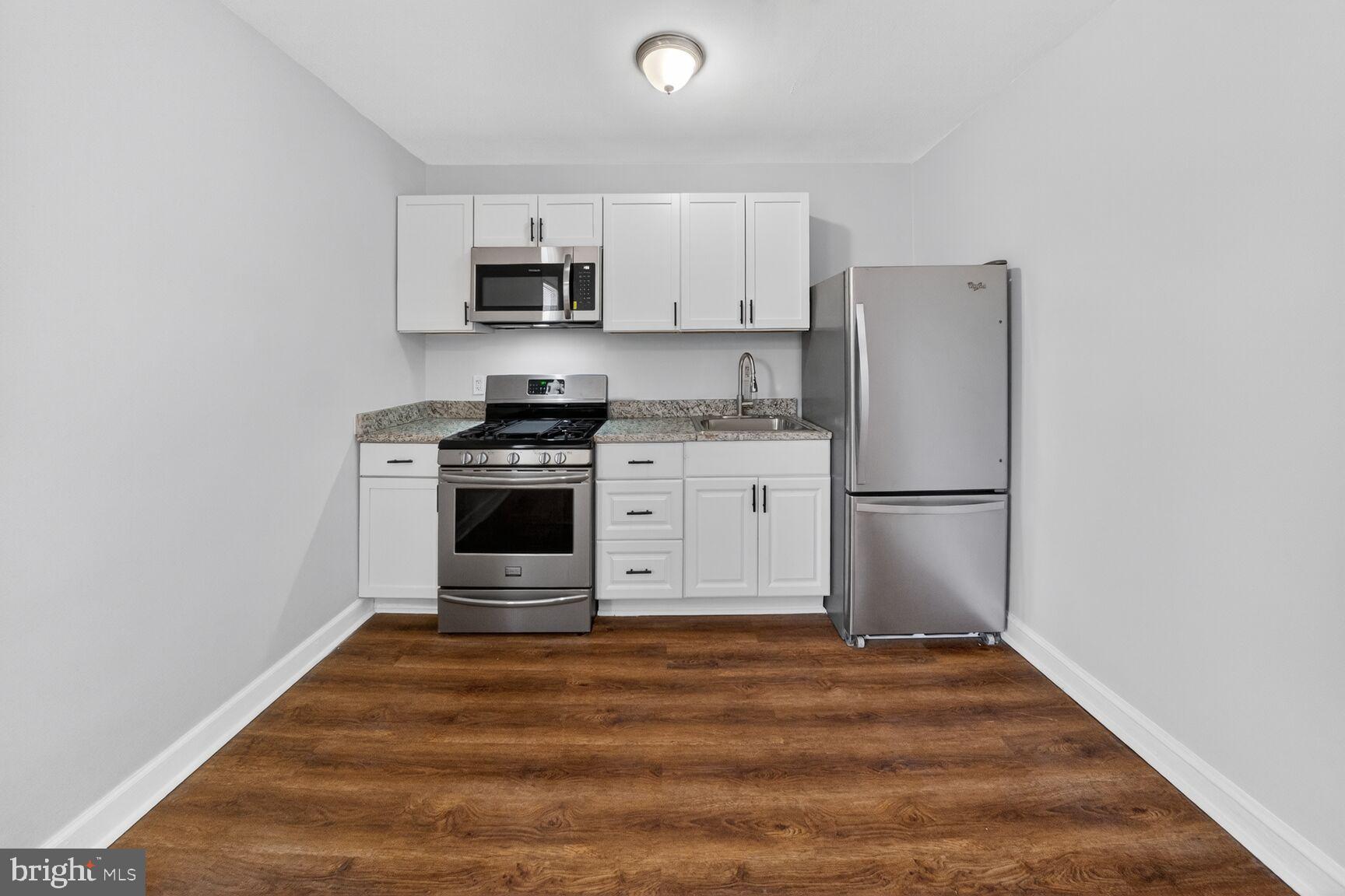 4701 Ravenswood Road, Unit 24 Riverdale, MD 20737 - Photo 8 of 14 Modern kitchen with sleek finishes.