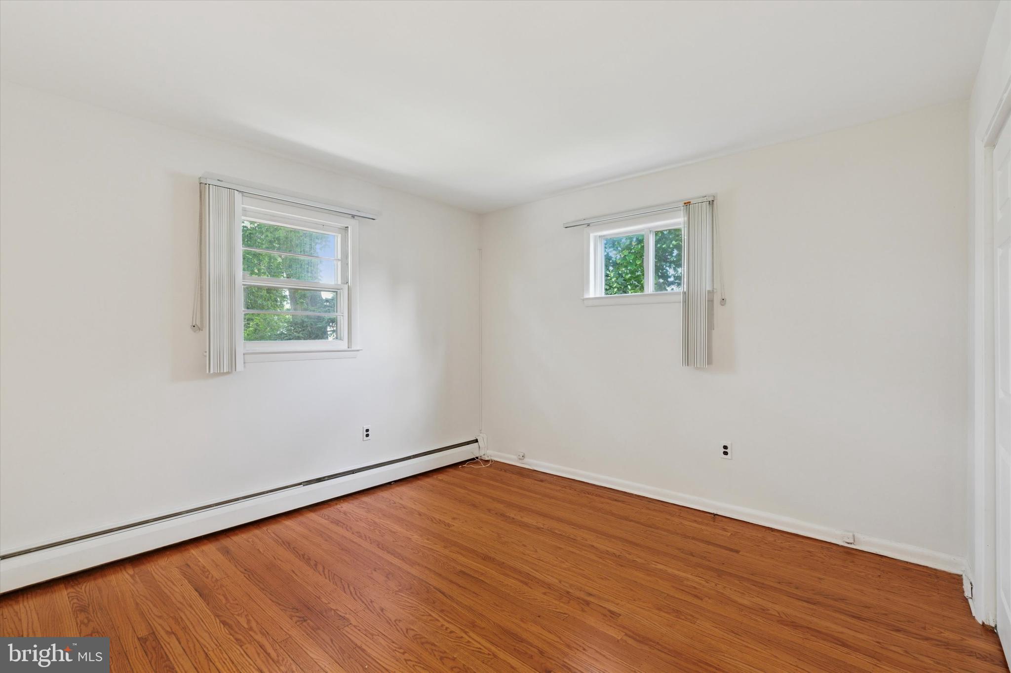 1948 Lukens Avenue Willow Grove, PA 19090 - Photo 11 of 23 an empty room with wooden floor and windows