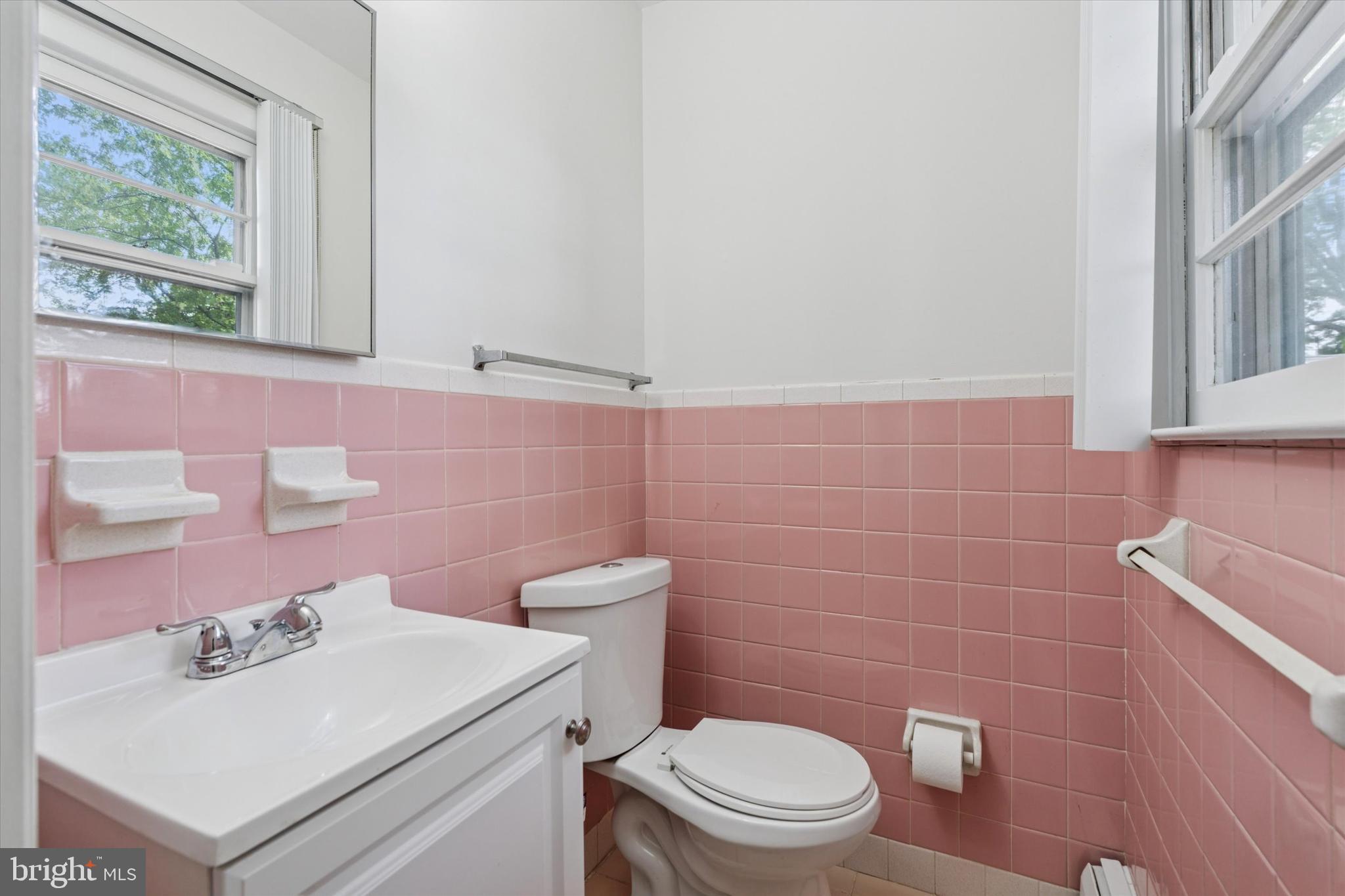 1948 Lukens Avenue Willow Grove, PA 19090 - Photo 14 of 23 a bathroom with a sink a toilet and a mirror