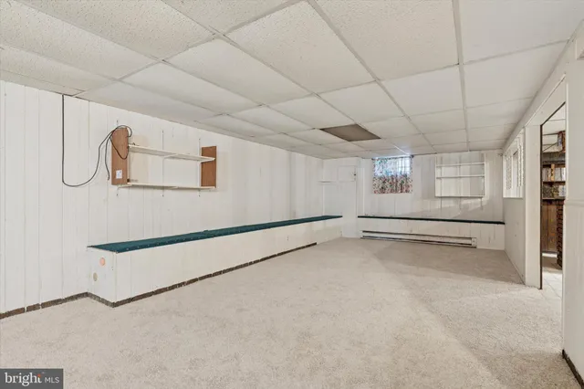 a view of an empty room with white walls