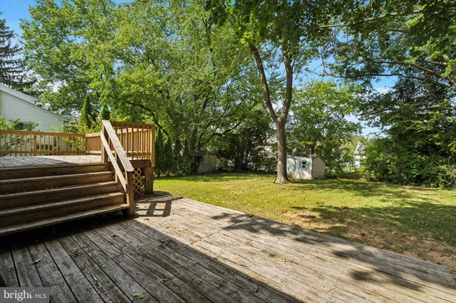a view of a backyard with swimming pool