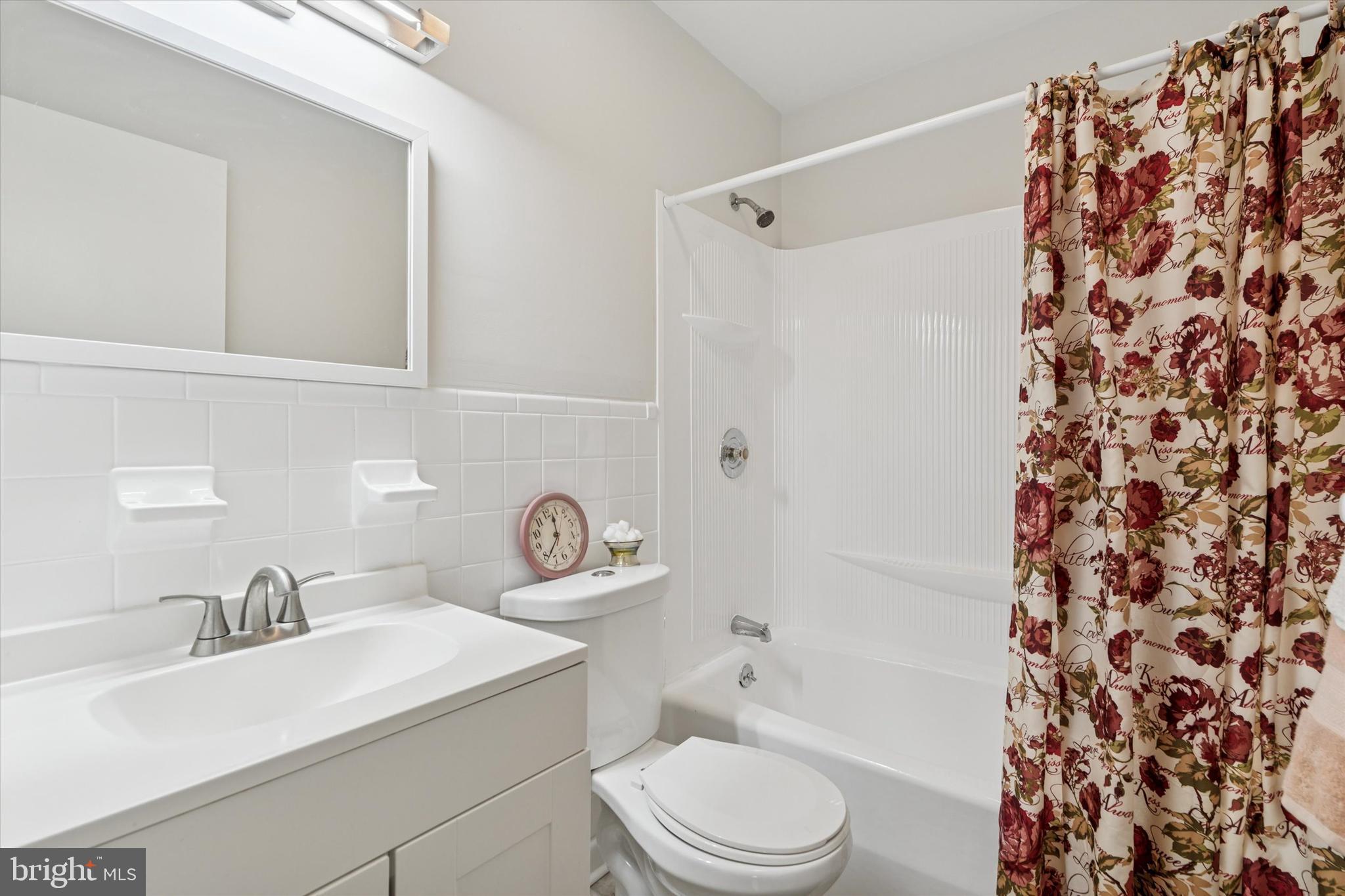1948 Lukens Avenue Willow Grove, PA 19090 - Photo 9 of 23 a bathroom with a sink toilet a mirror and shower